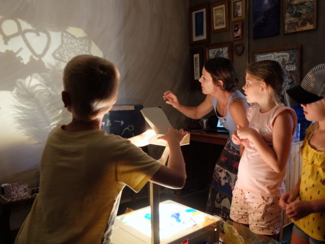 Children exploring shadows with a light-box